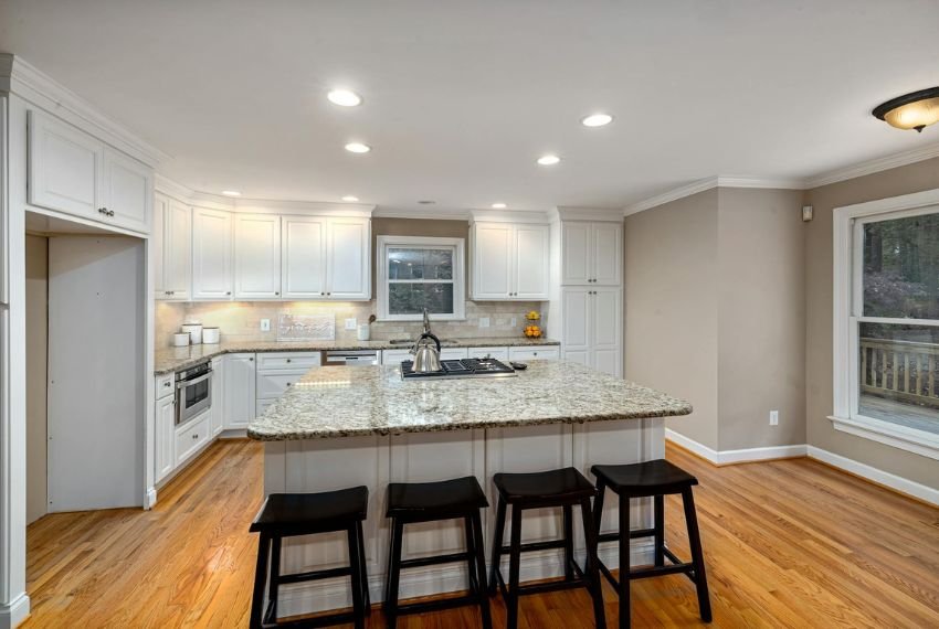 Hardwood Floor in Kitchen with White Cabinets