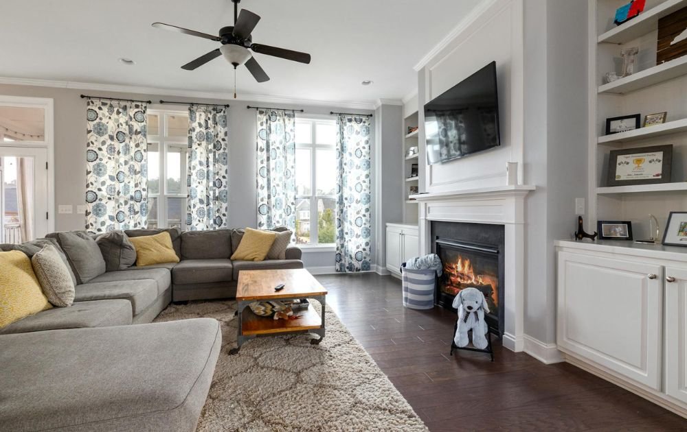 Living room with one side window view and infront Fireplace