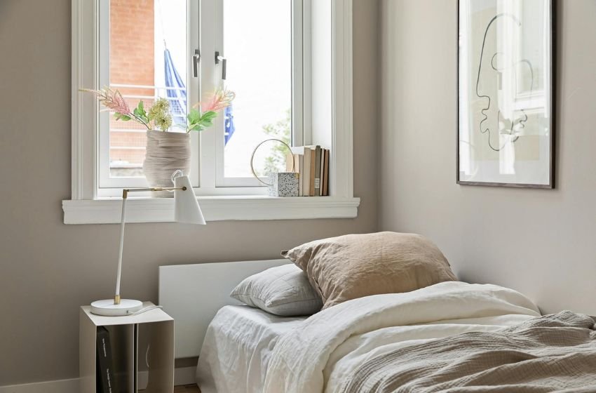 small bedroom with corner bed