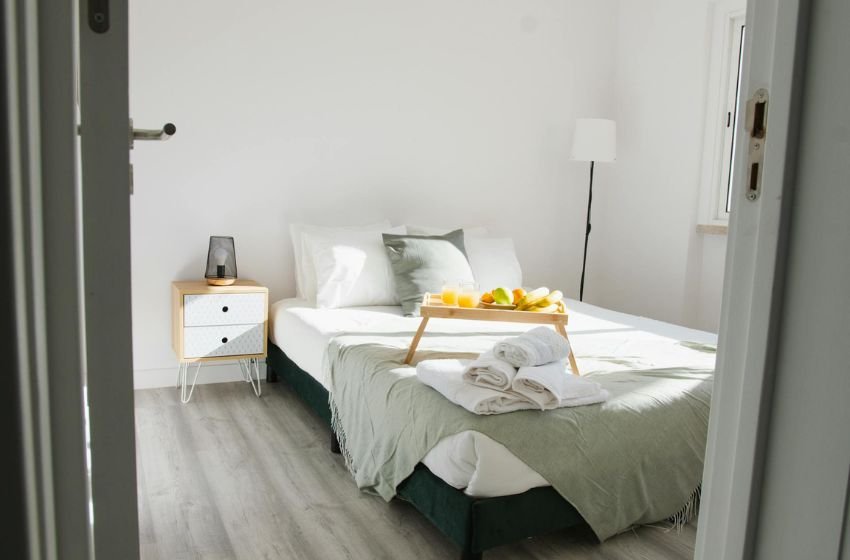 small bedroom with corner bed