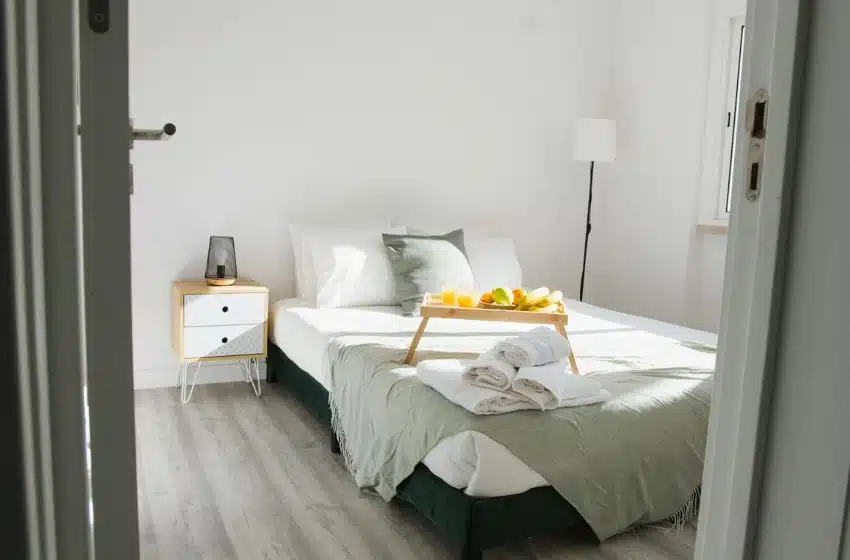 small bedroom with corner bed 