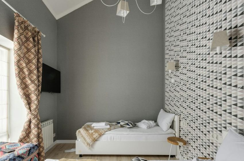small bedroom with corner bed