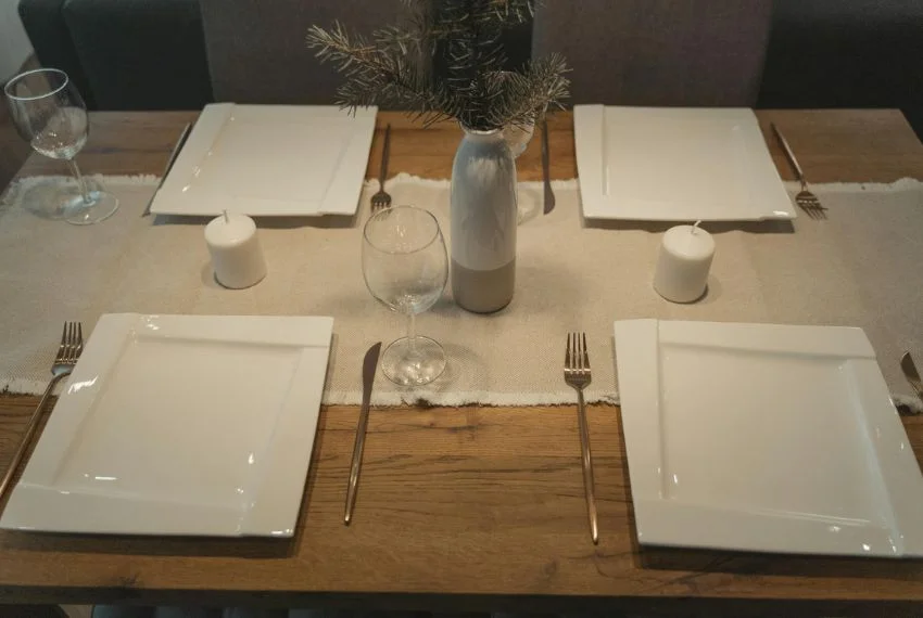 Minimalist Thanksgiving table decor with candles and simple runner