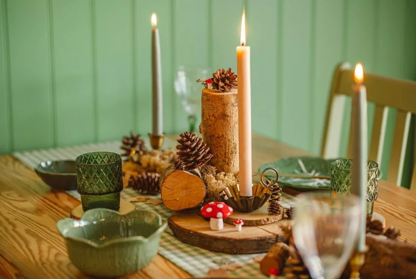 Easy Thanksgiving table decorations with candles and small pumpkins.