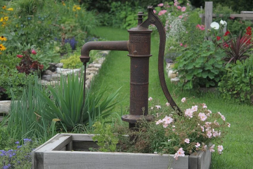 Antique Water Pump with Flower Beds
