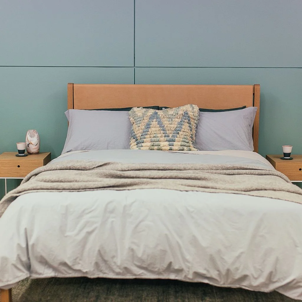 Soft Lilac Walls with Warm Oak Furniture