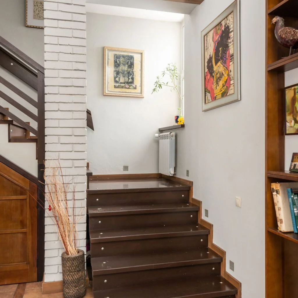 A Gallery Wall Turns the Stairwell Into an Art Trail