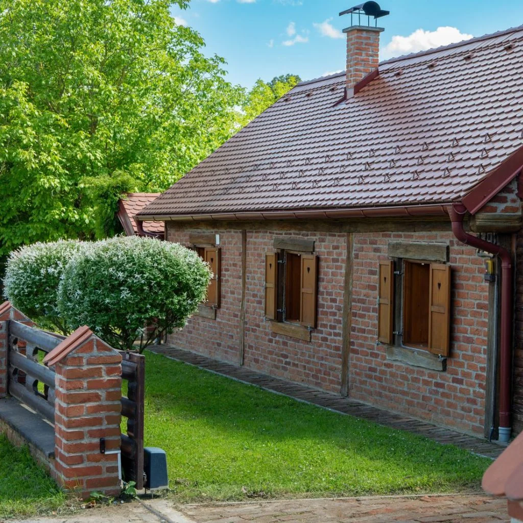 Brick Piers With Timber Infill Balance Warmth and Structure