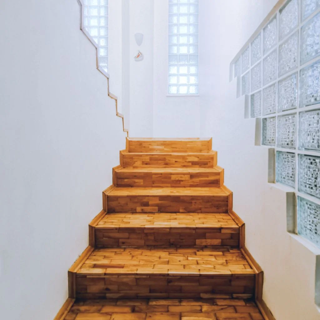 Cluster Of Mirrors Bounces Light Up The Stairwell