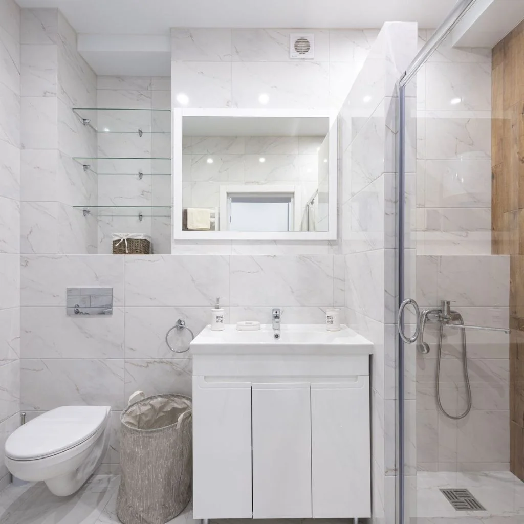 Glass Shelves Keep a Small Bathroom Feeling Open