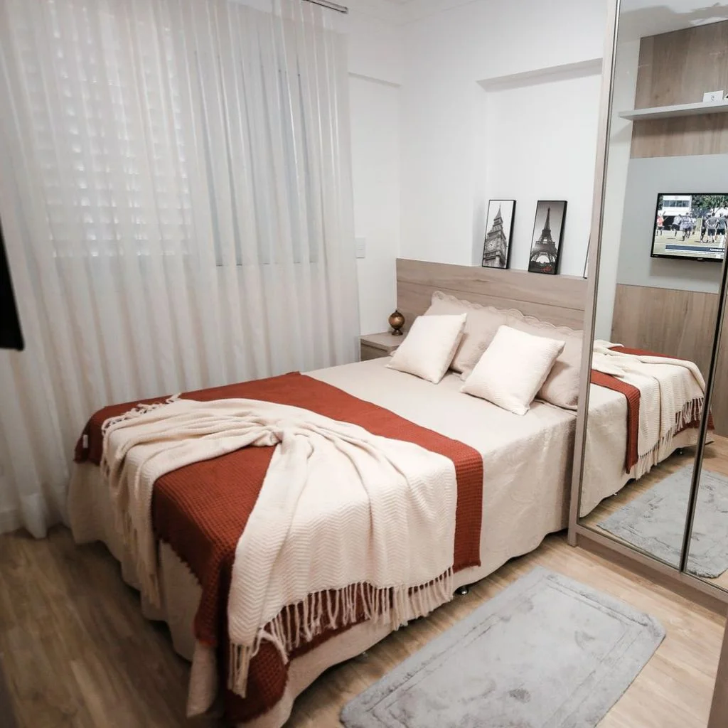 Neutral Layering Makes A Small Bedroom Feel Considerably Larger