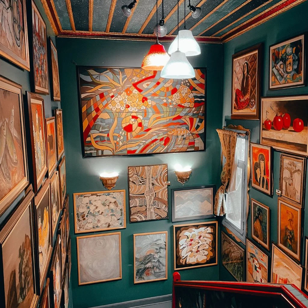 Staggered Gallery Wall Follows The Staircase Line
