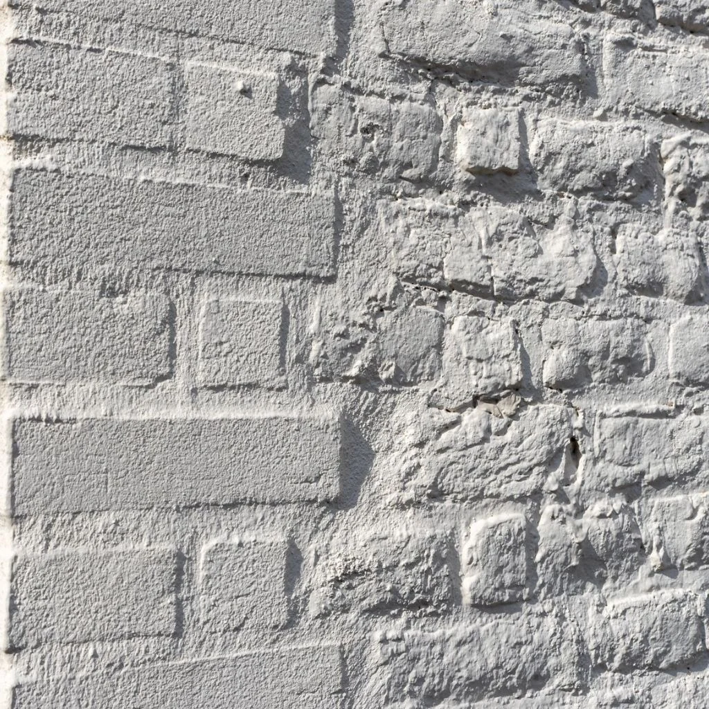 Whitewashed Brick Softens a Heavy Boundary Wall