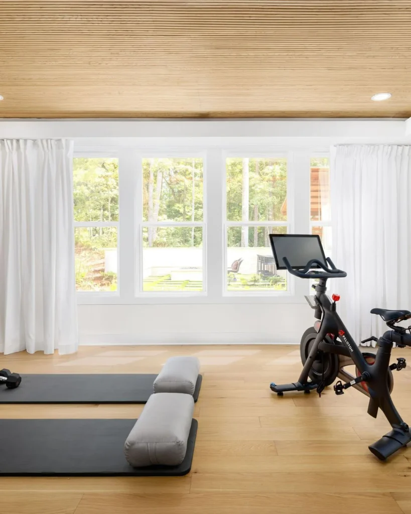Farmhouse home cycling corner with shiplap panels and woven basket