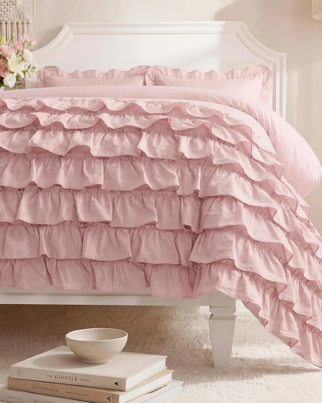 Light pink bed with cascading ruffle duvet cover and ruffled pillow shams